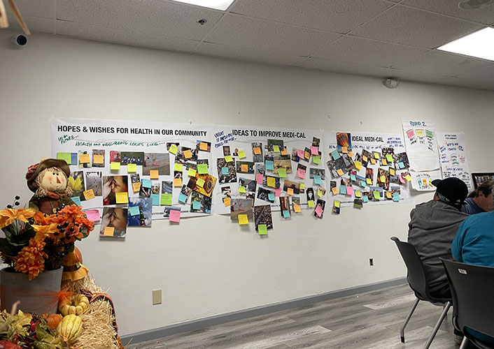 Wall with post-it notes capturing member feedback.