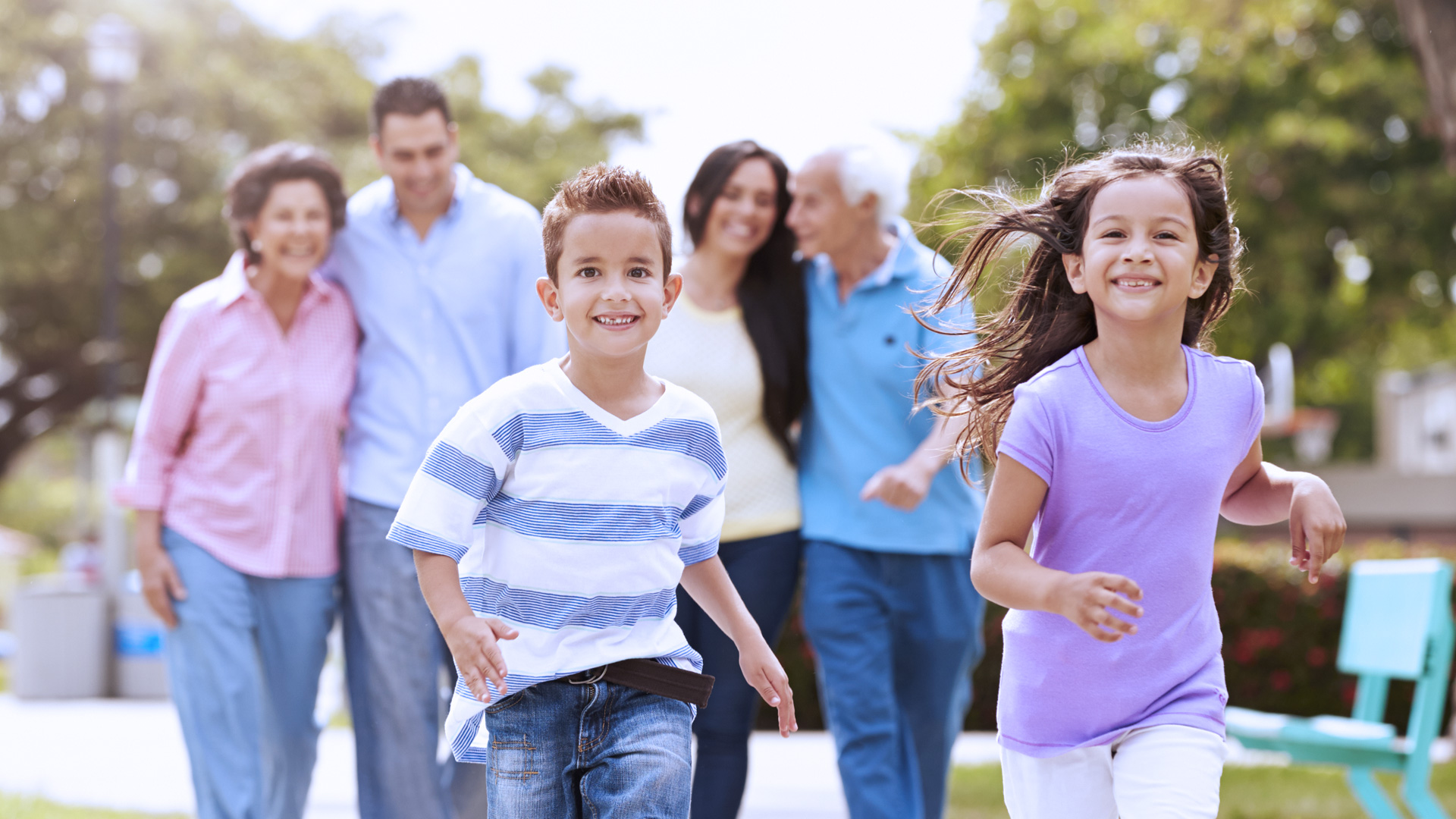 Family walking through park